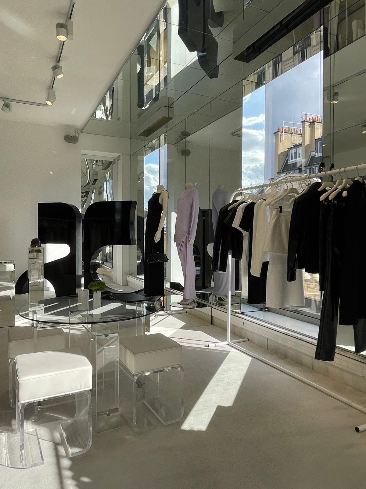 Courrèges boutique in Paris: mirrored walls, acrylic furniture and the black logo sculpture