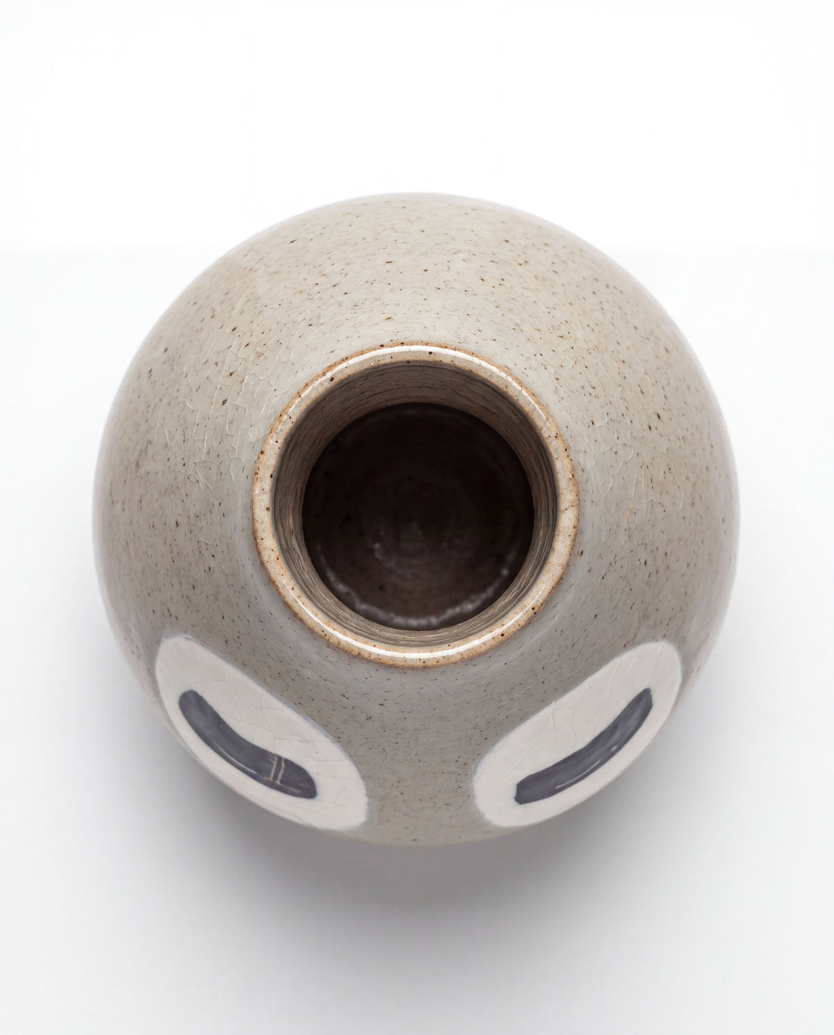 Ivory grey ceramic bud vase with two closed eyes, handmade in Korea, detail 2