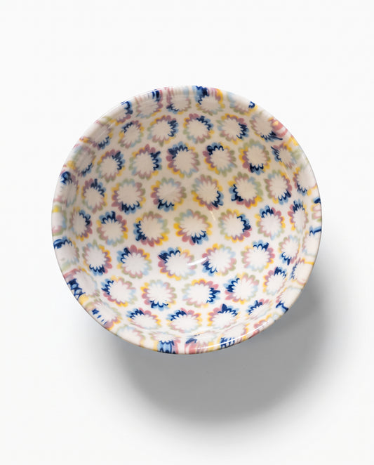 ACULI 1000 Flower Rainbow bowl seen from above, blue, yellow and pink neriage flowers on white