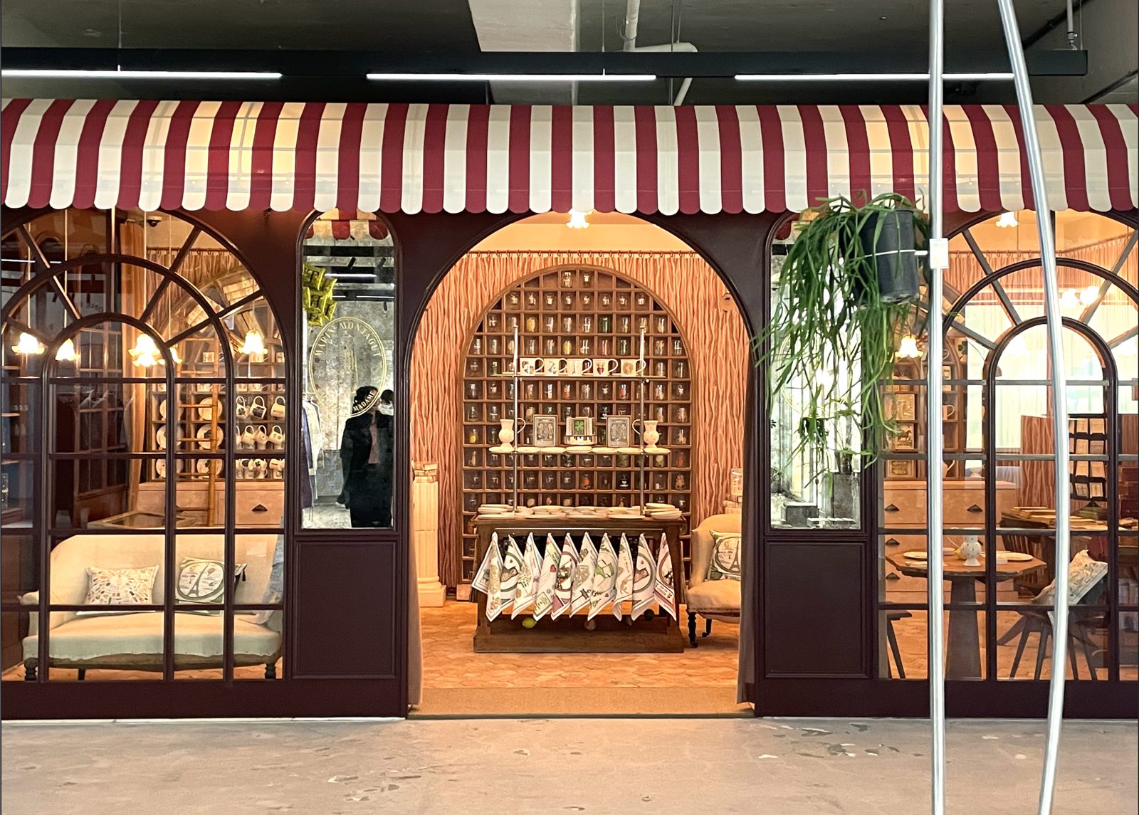 Marin Montagut pop-up shopfront in Seoul with a striped awning and arched windows